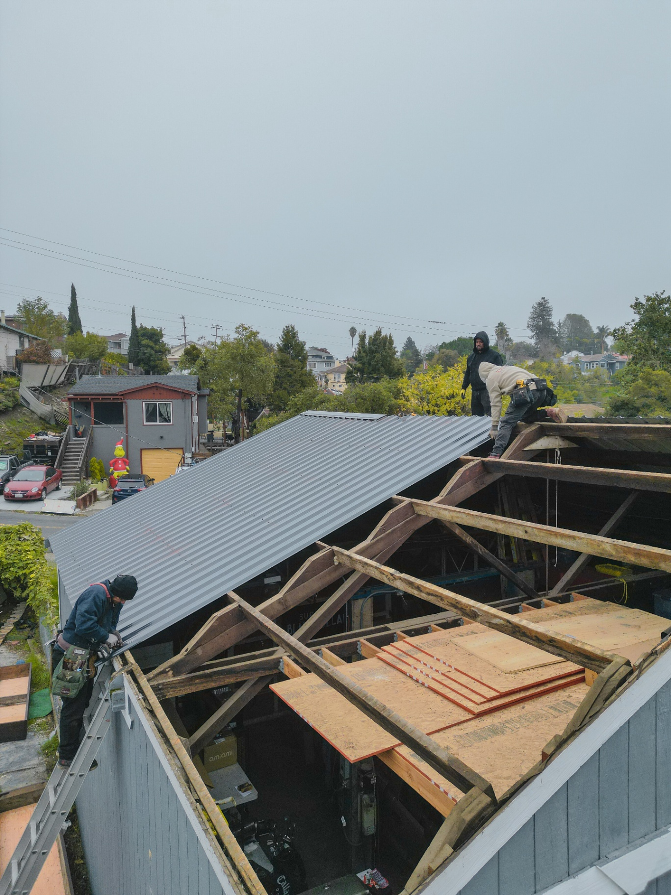Installing new standing seam metal roofing panels