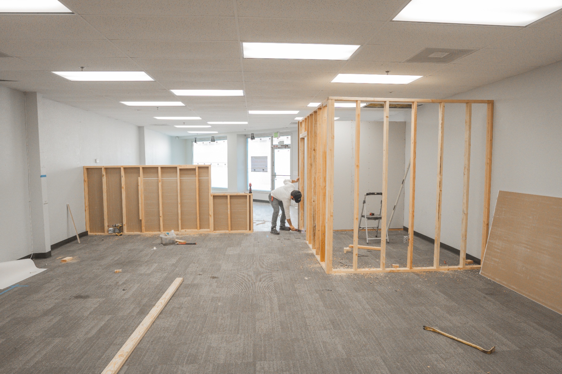 Crew framing interior office walls in commercial space