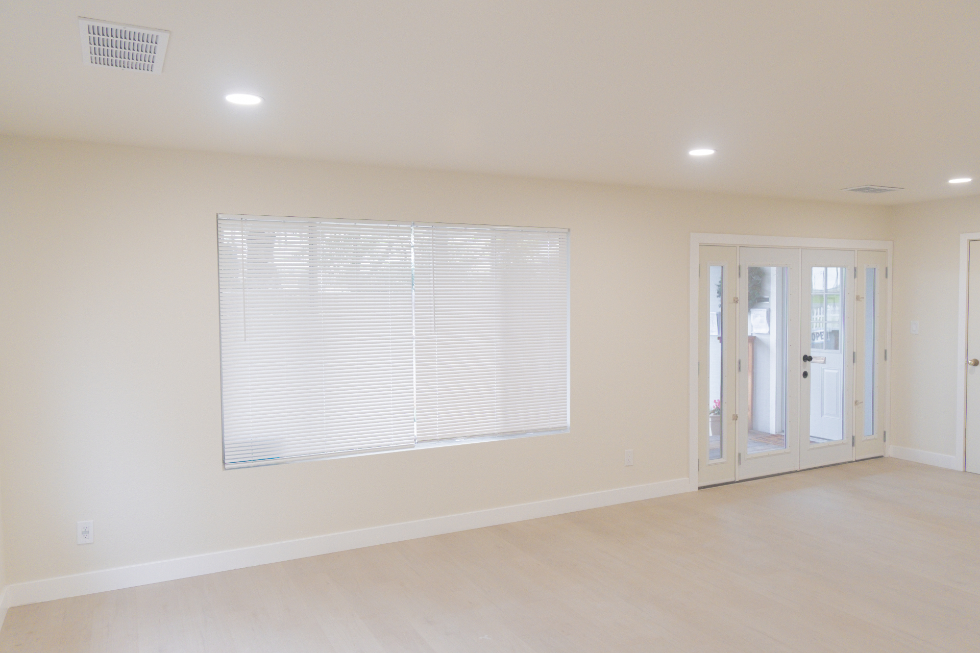 Move-in ready interior with new floors, recessed lighting, and French doors