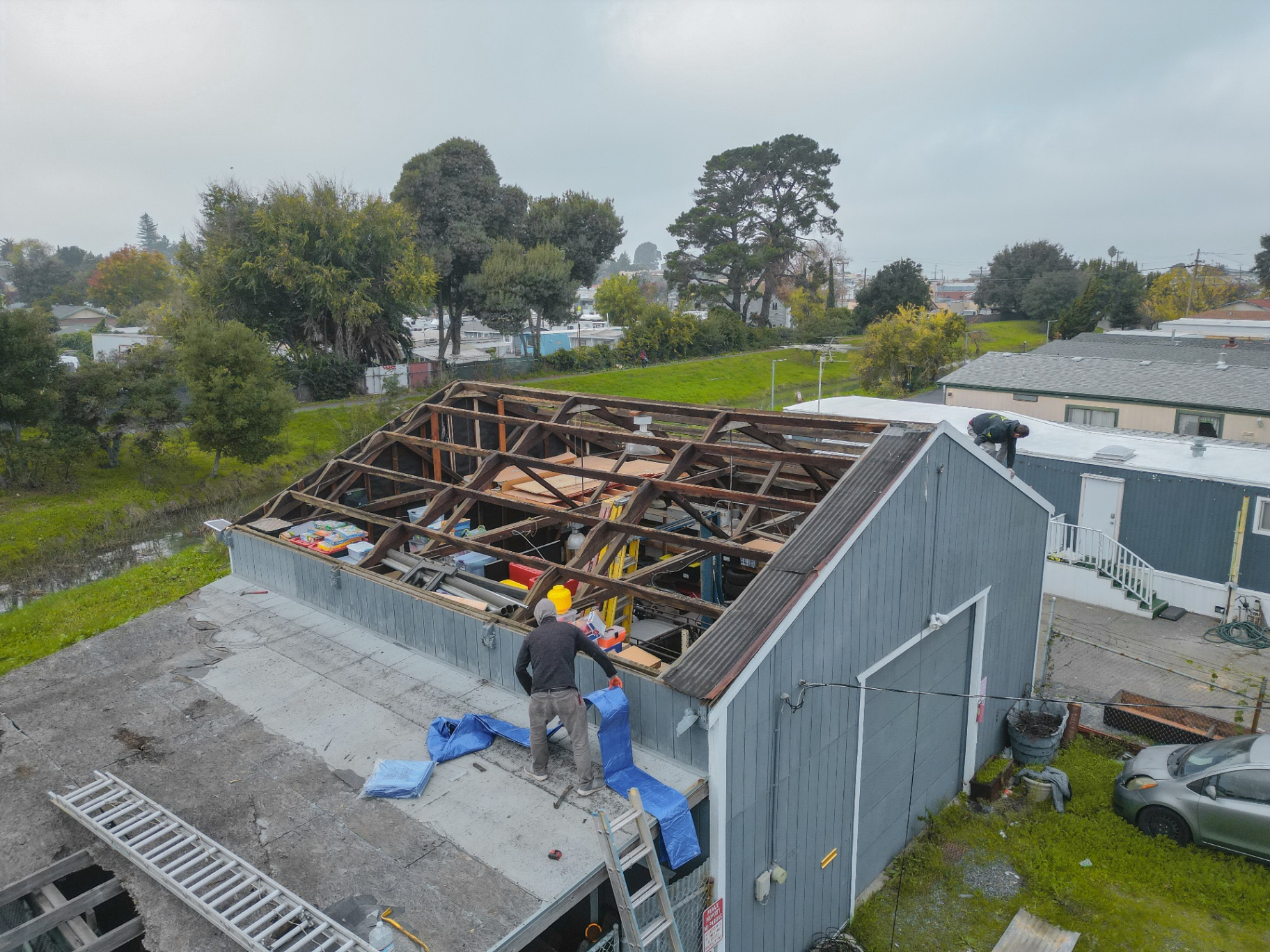 Aerial view of roof tear-off in progress