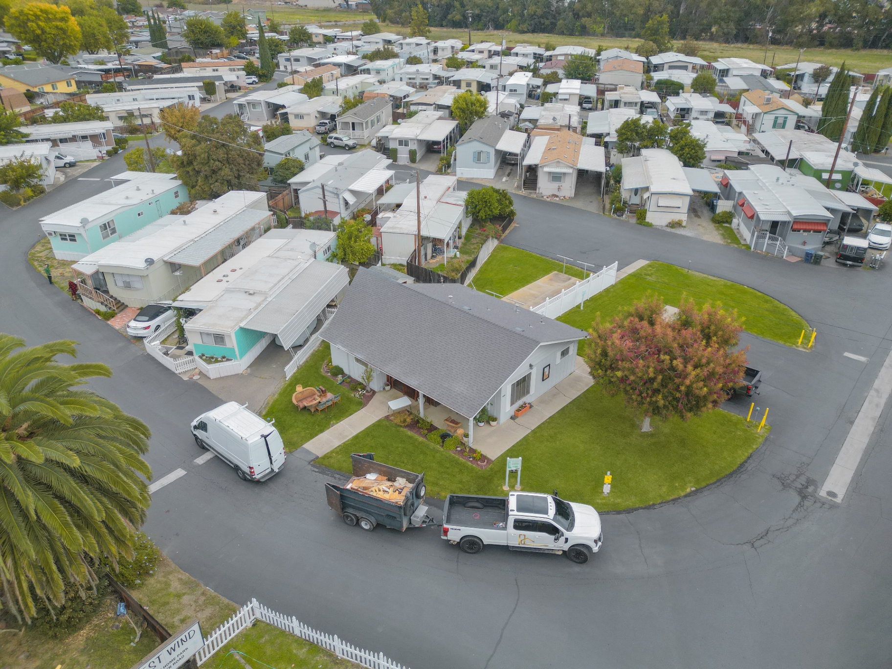 Wide aerial overview of finished home in mobile home community