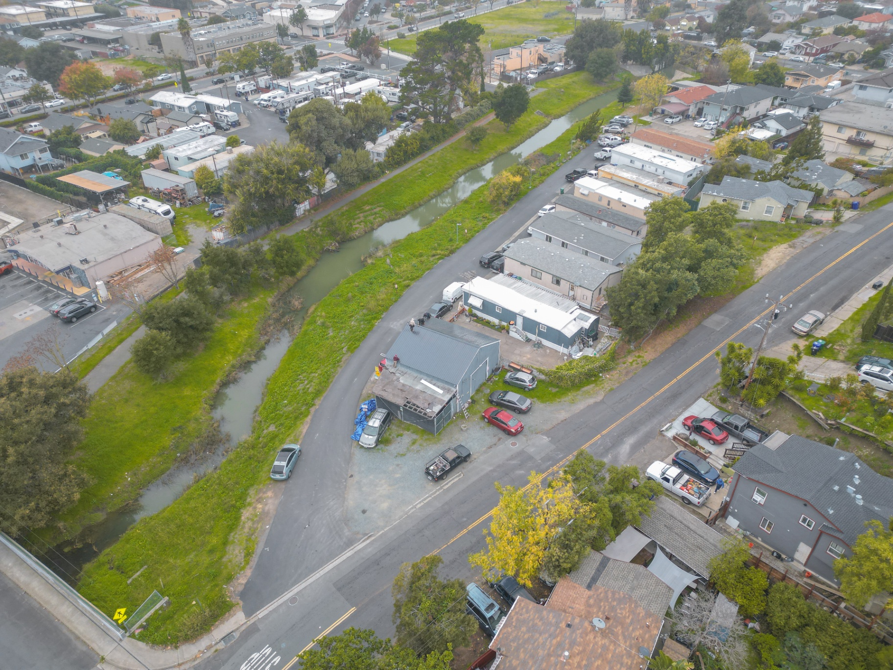 Wide aerial overview of completed roofing project