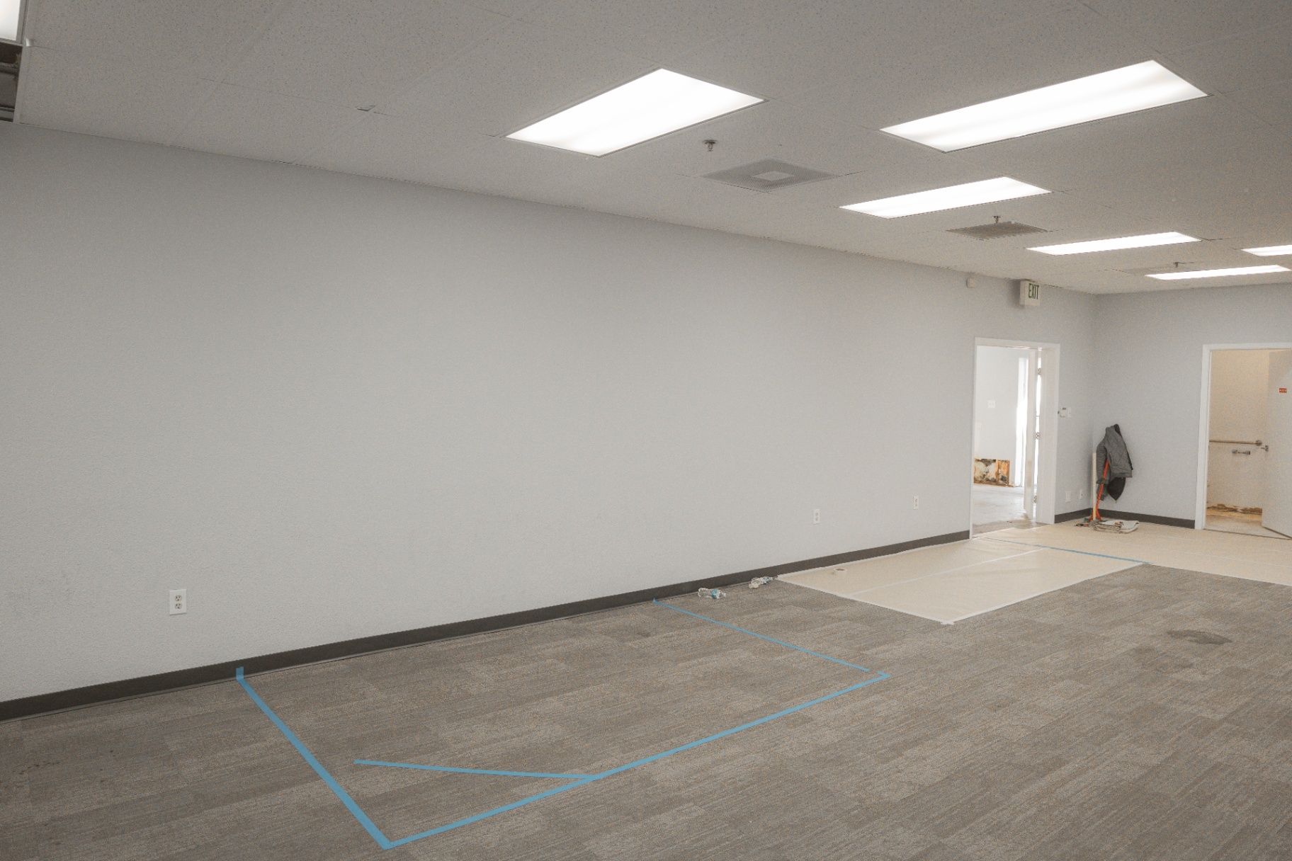 Empty commercial space prepped with layout markings for buildout