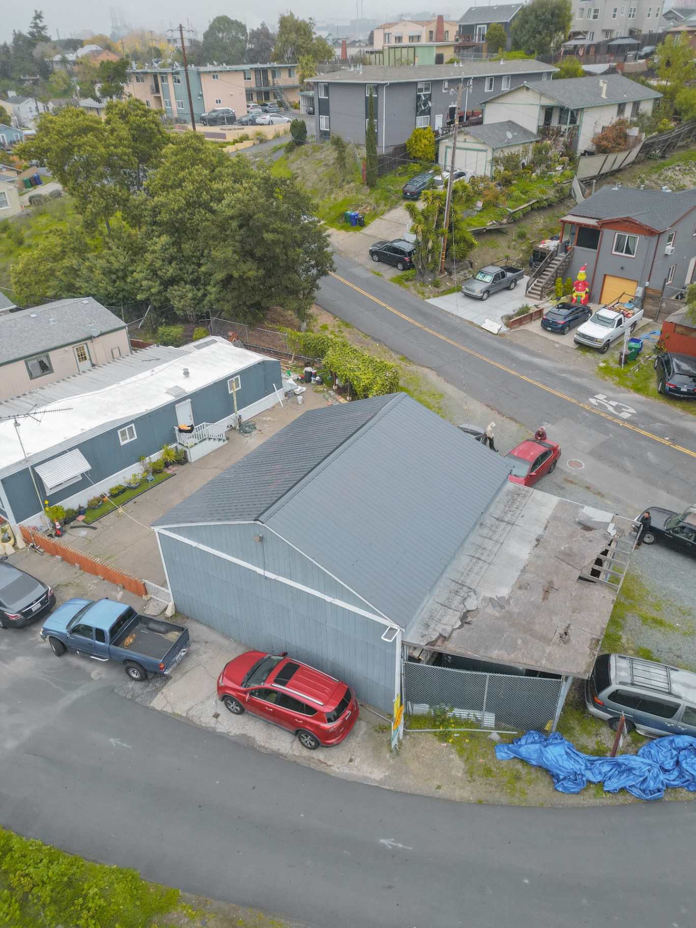 Finished metal roof with surrounding neighborhood view