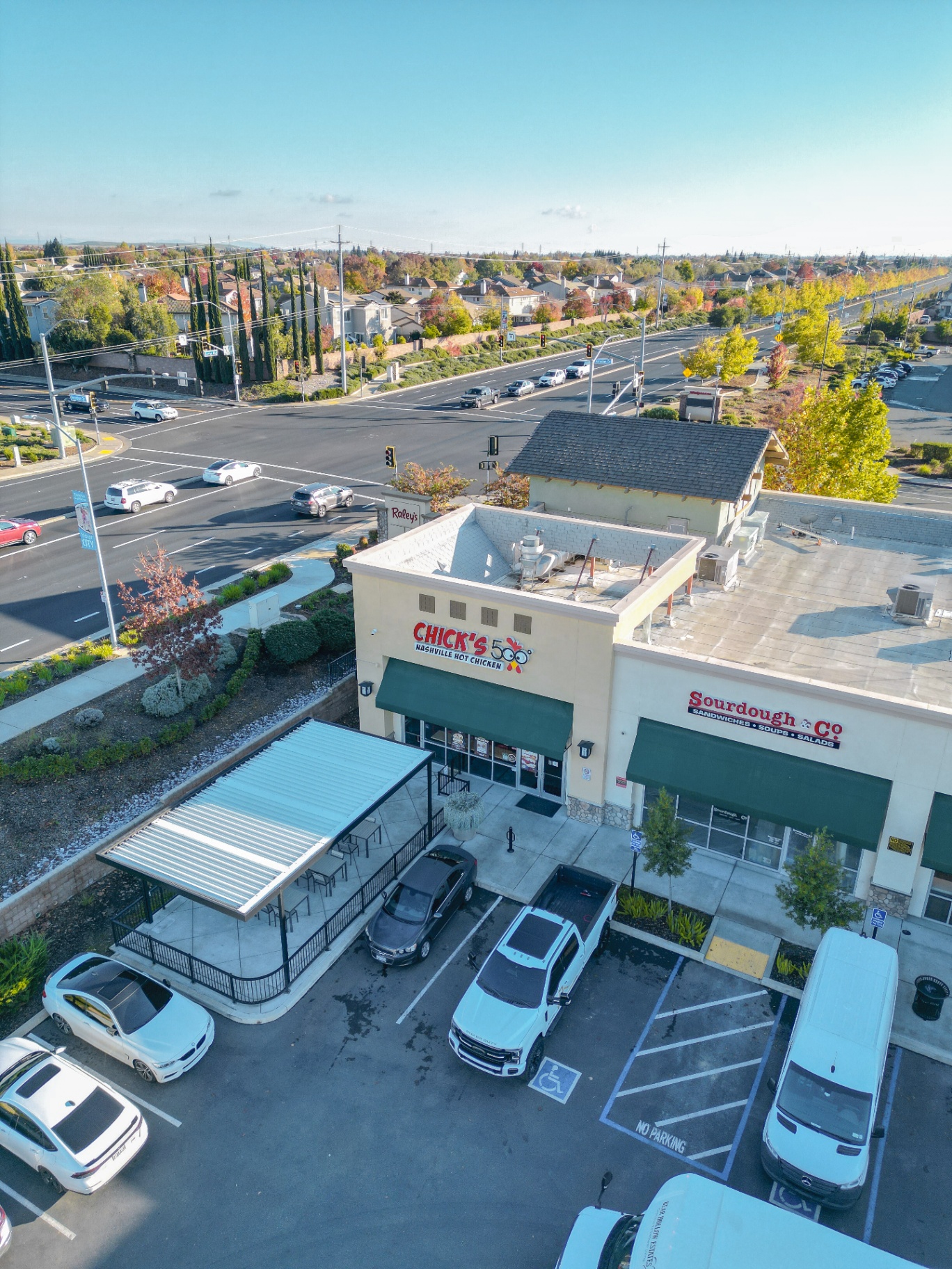 Aerial view of commercial retail building and patio cover