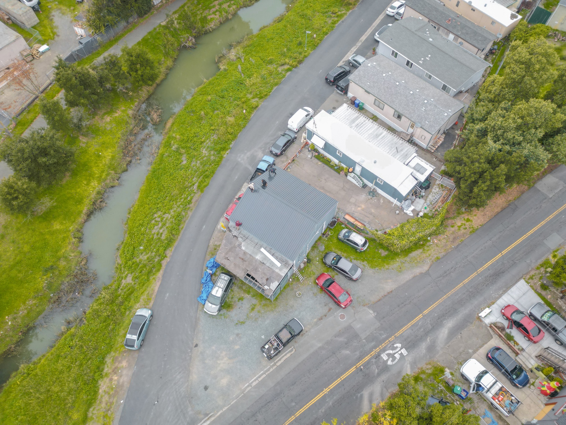 High-angle drone shot showing the finished roof from above