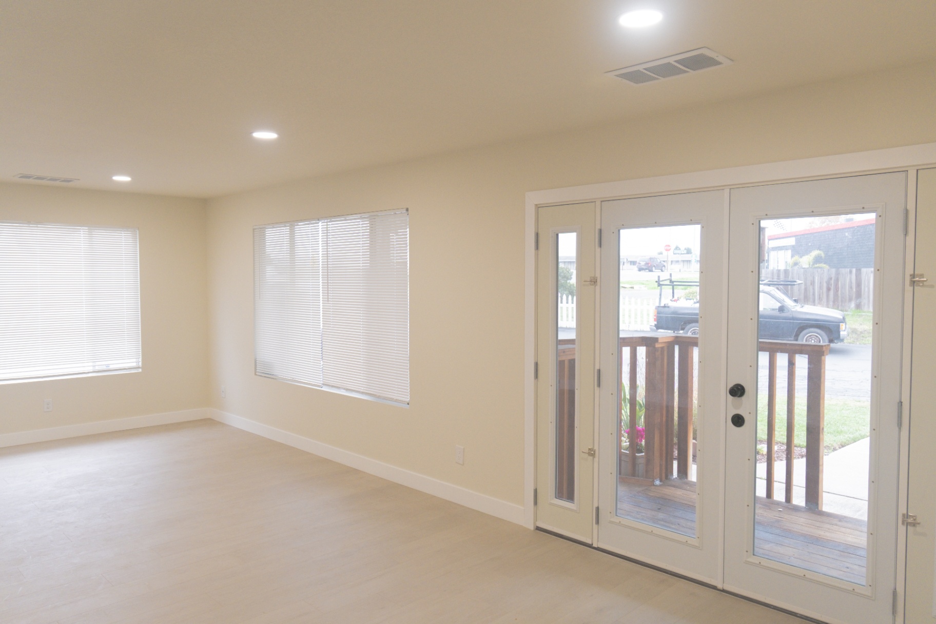 Finished ADU interior with fresh paint and French doors to deck