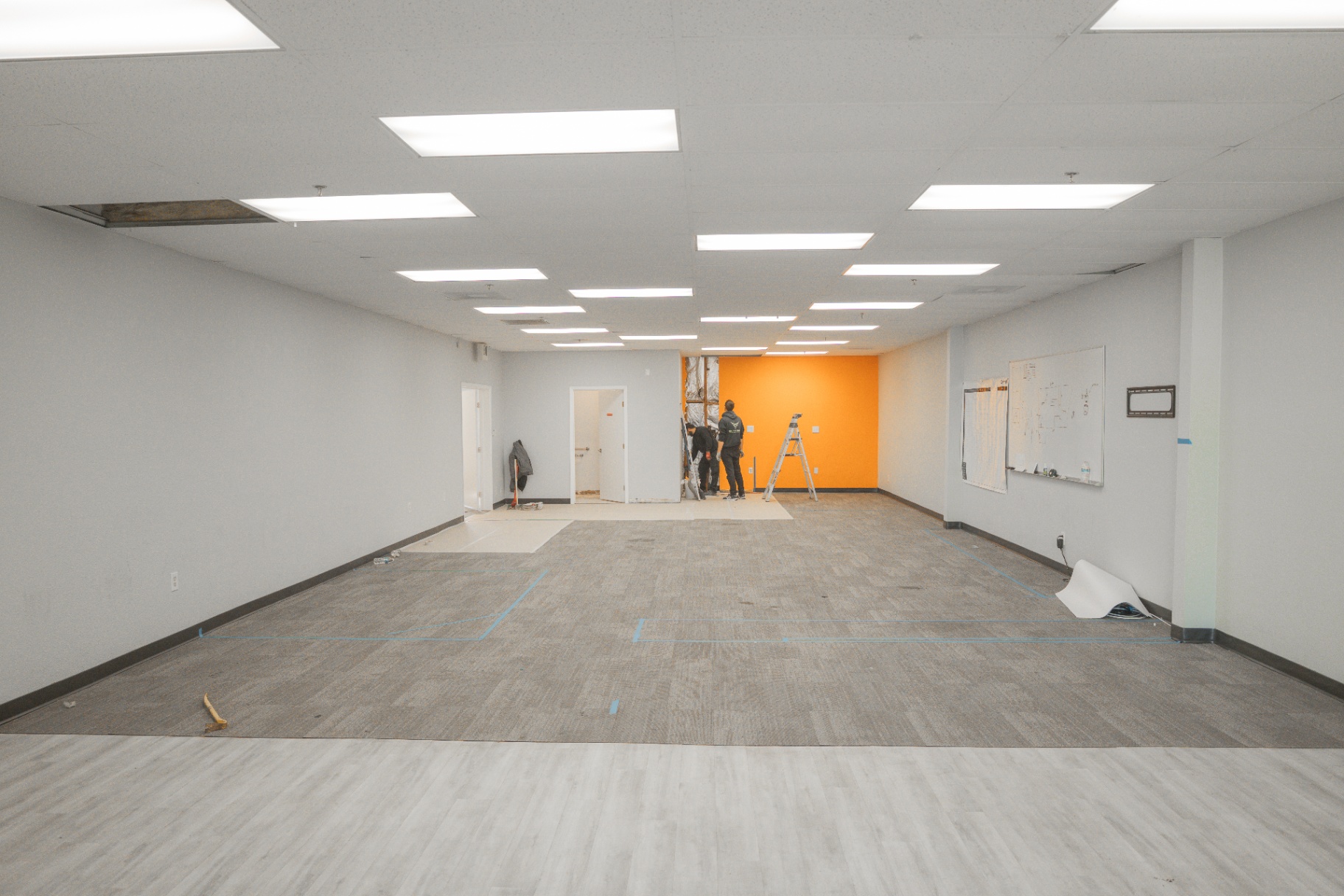 Wide view of commercial interior remodel space during demolition